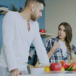 Couple arguing in a kitchen